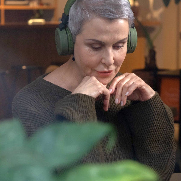 Woman listening to cancer information podcast